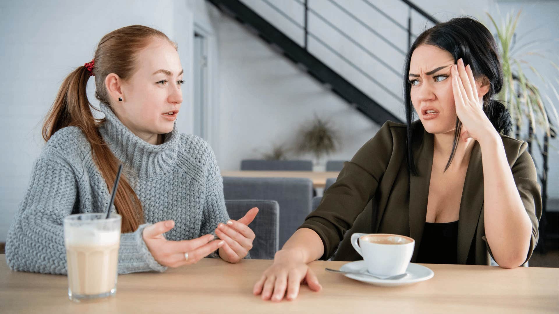 pretentious woman talking to uninterested and bothered friend