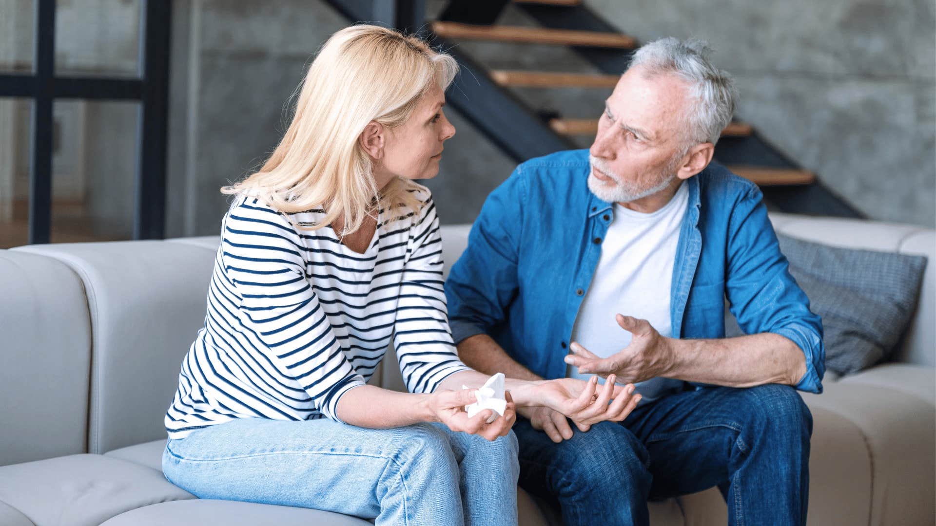 older couple discussing tense situation