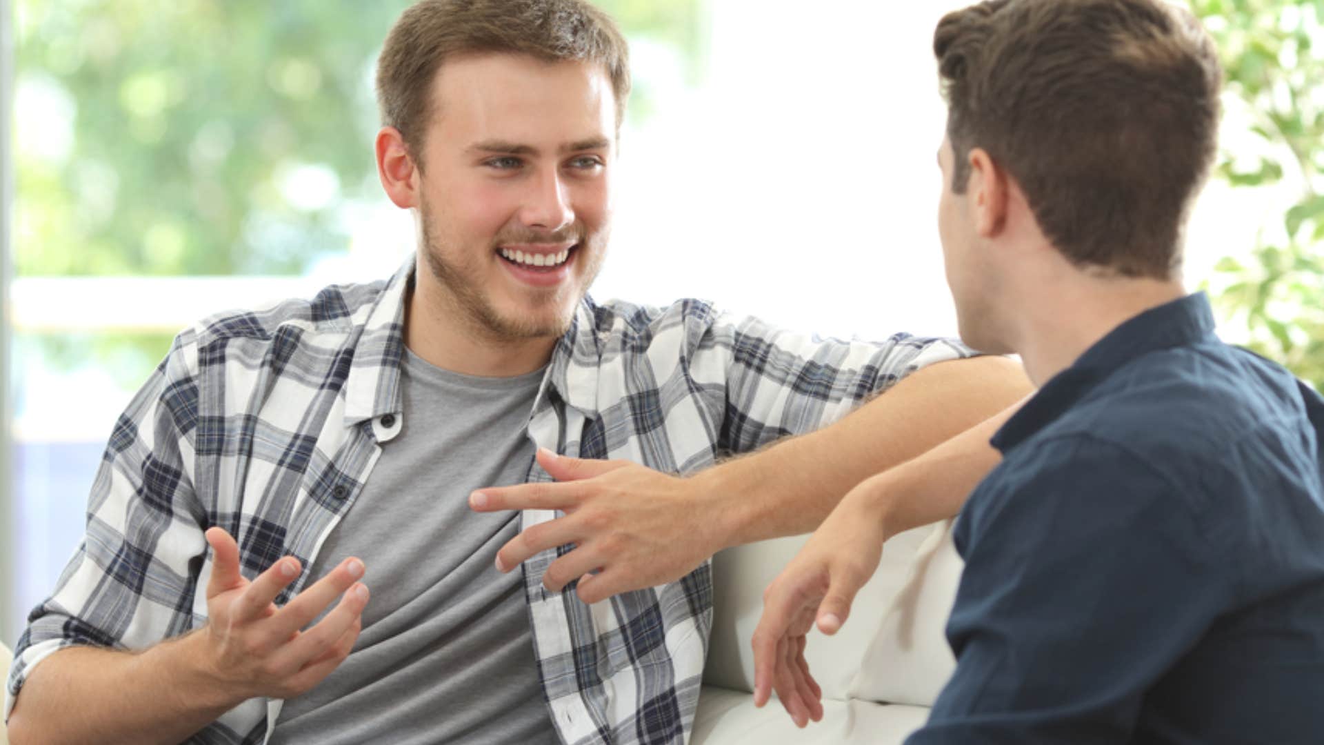 man faking being interested in friend's perspective