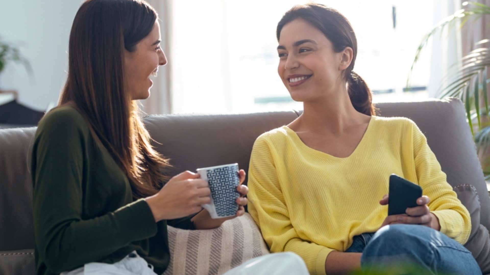 two women talking silently judging each other