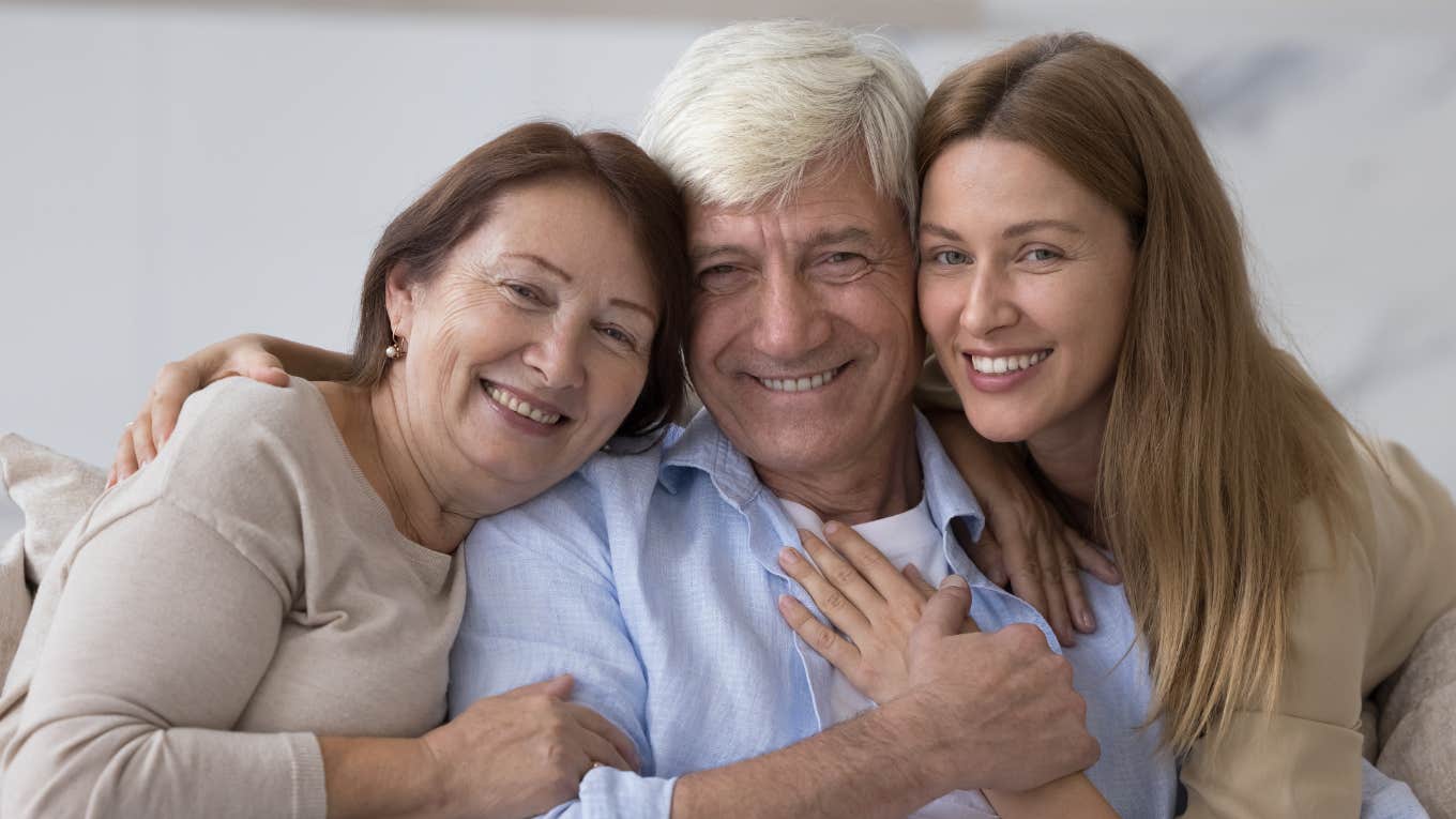Phrases People Use When They Were Raised By Classy Parents woman smiling alongside classy parents