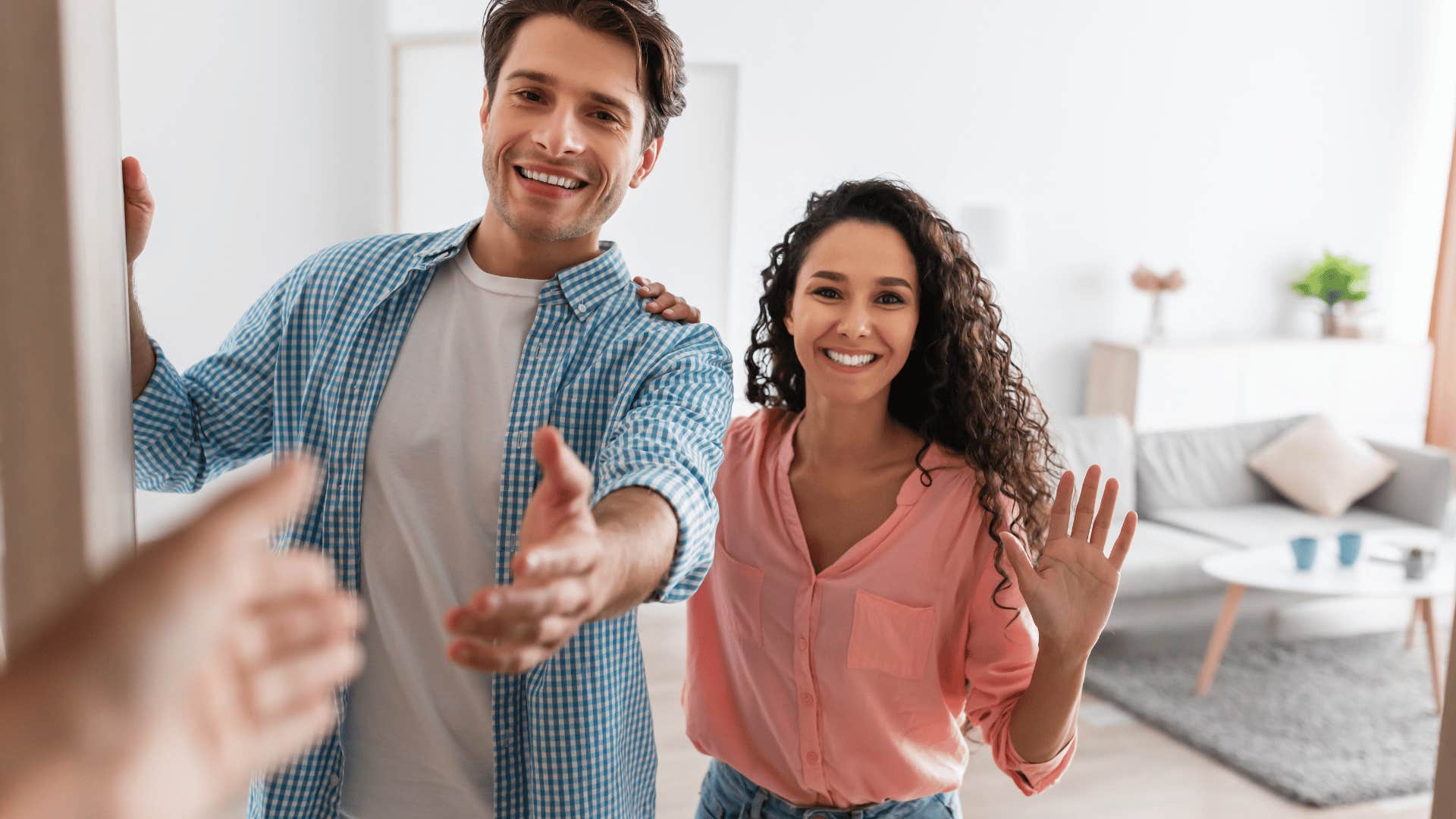 couple welcoming new friend into their home