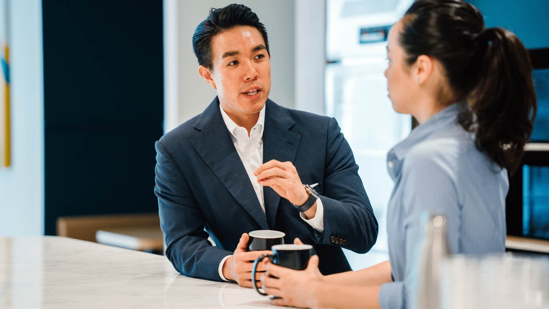man having conversation with employee speaking respectfully