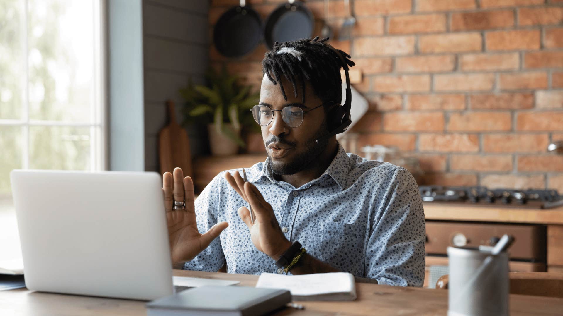 man speaking on video call without interrupting
