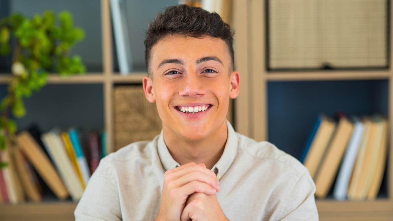 smiling young man being a pushover not standing up for himself