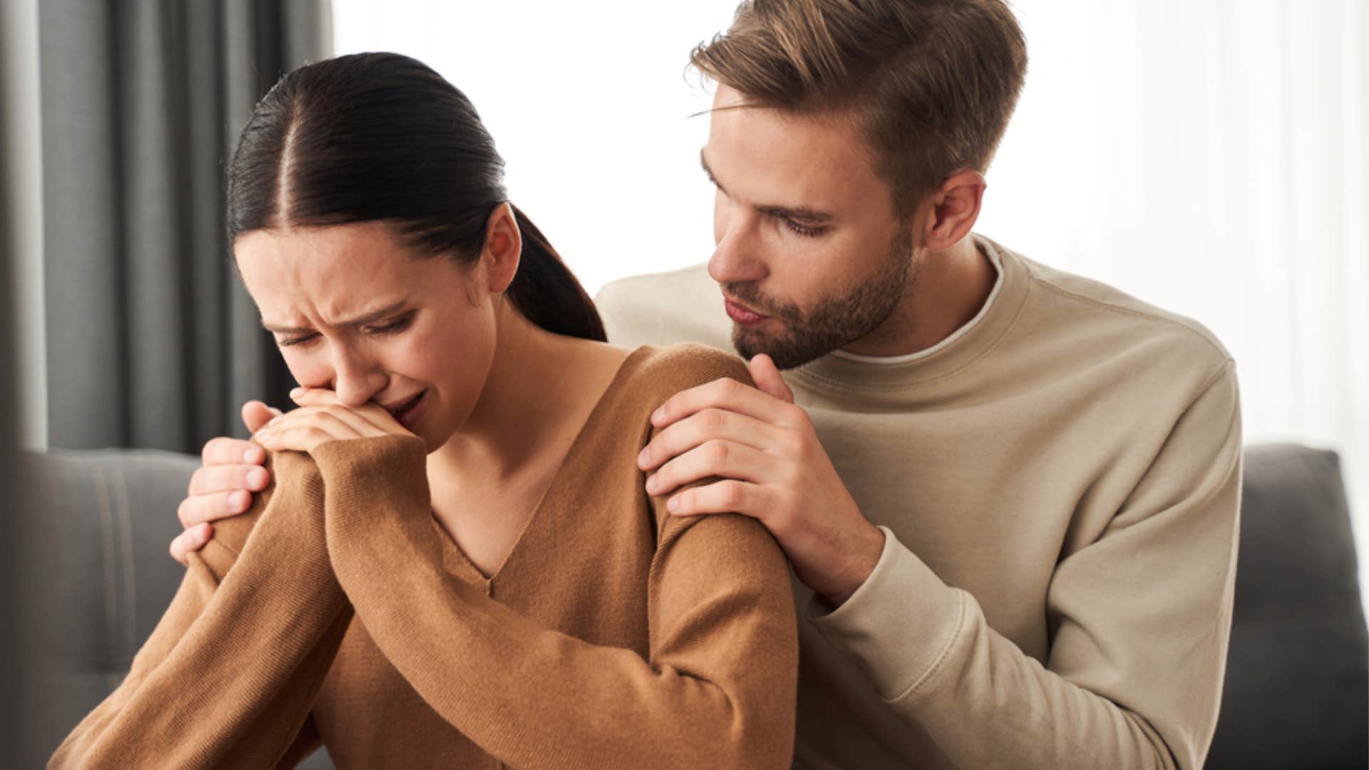 husband trying to comfort emotional wife