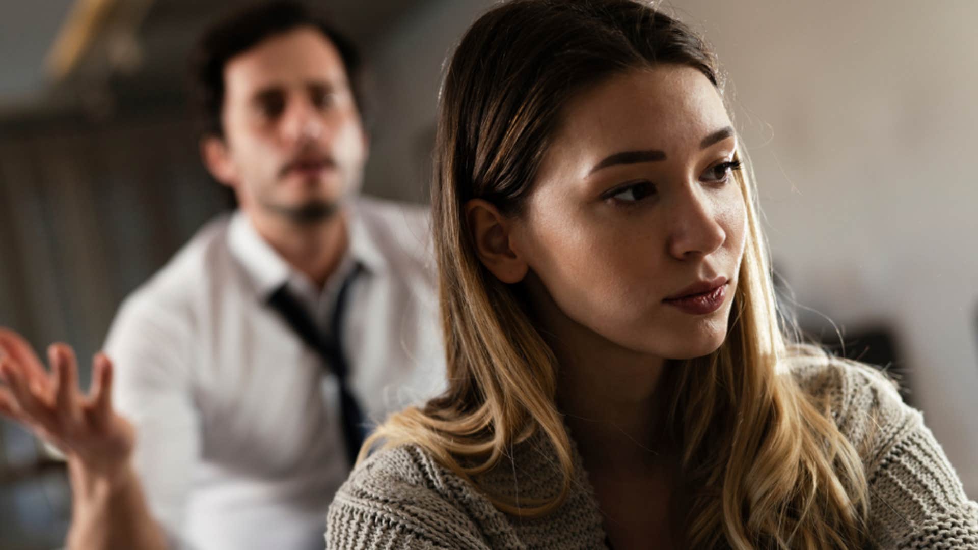 upset wife hurting from husband insulting her