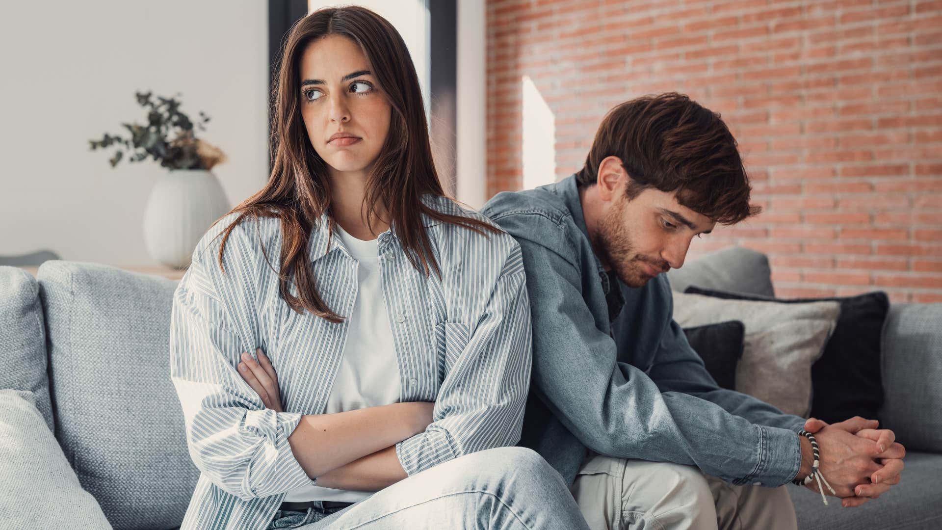 Woman thinking "that's just how I am" turned away from her partner.