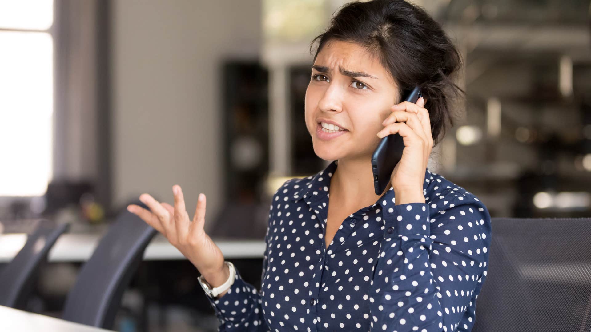 Woman arguing with someone on the phone saying "you're so dramatic."