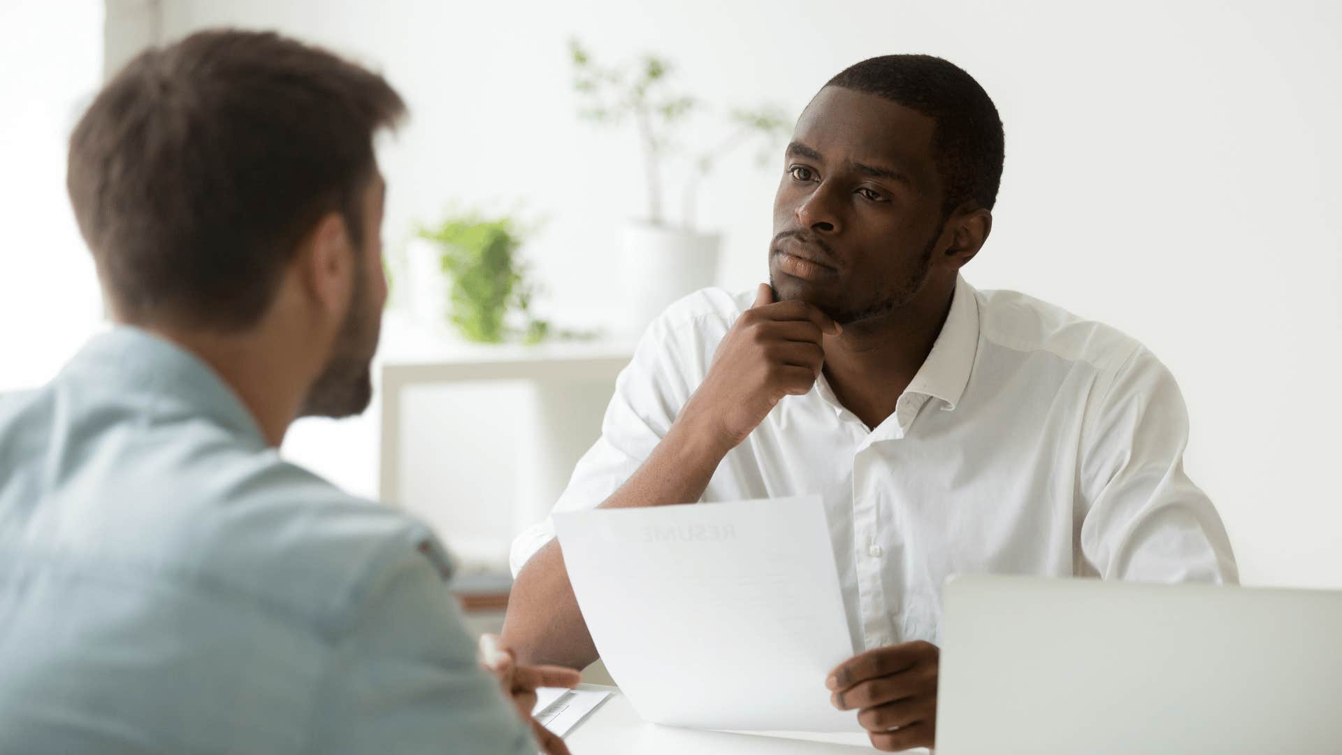 man listening to colleague speak before he says I value your input, but I need time to finish mine