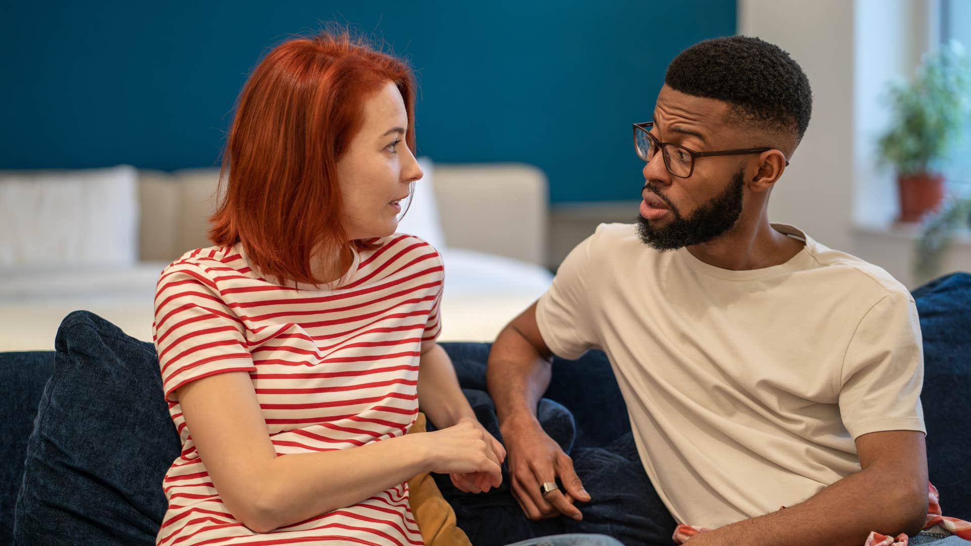 A woman asks her husband to tell her how he is feeling.