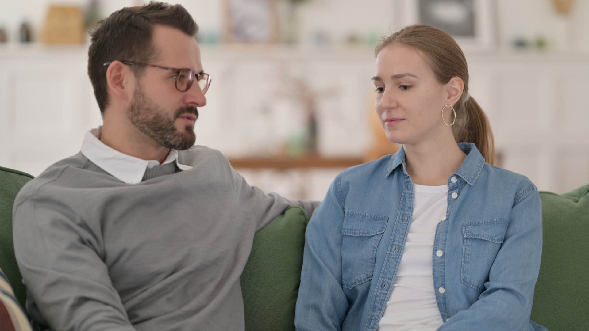 woman telling boyfriend she feels alone together
