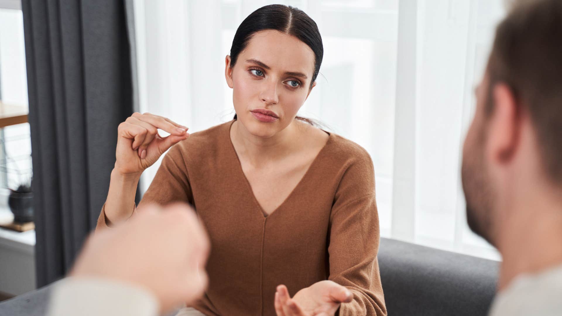 woman telling boyfriend they're too different