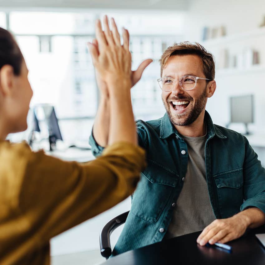 man who is unforgettable high-fiving woman