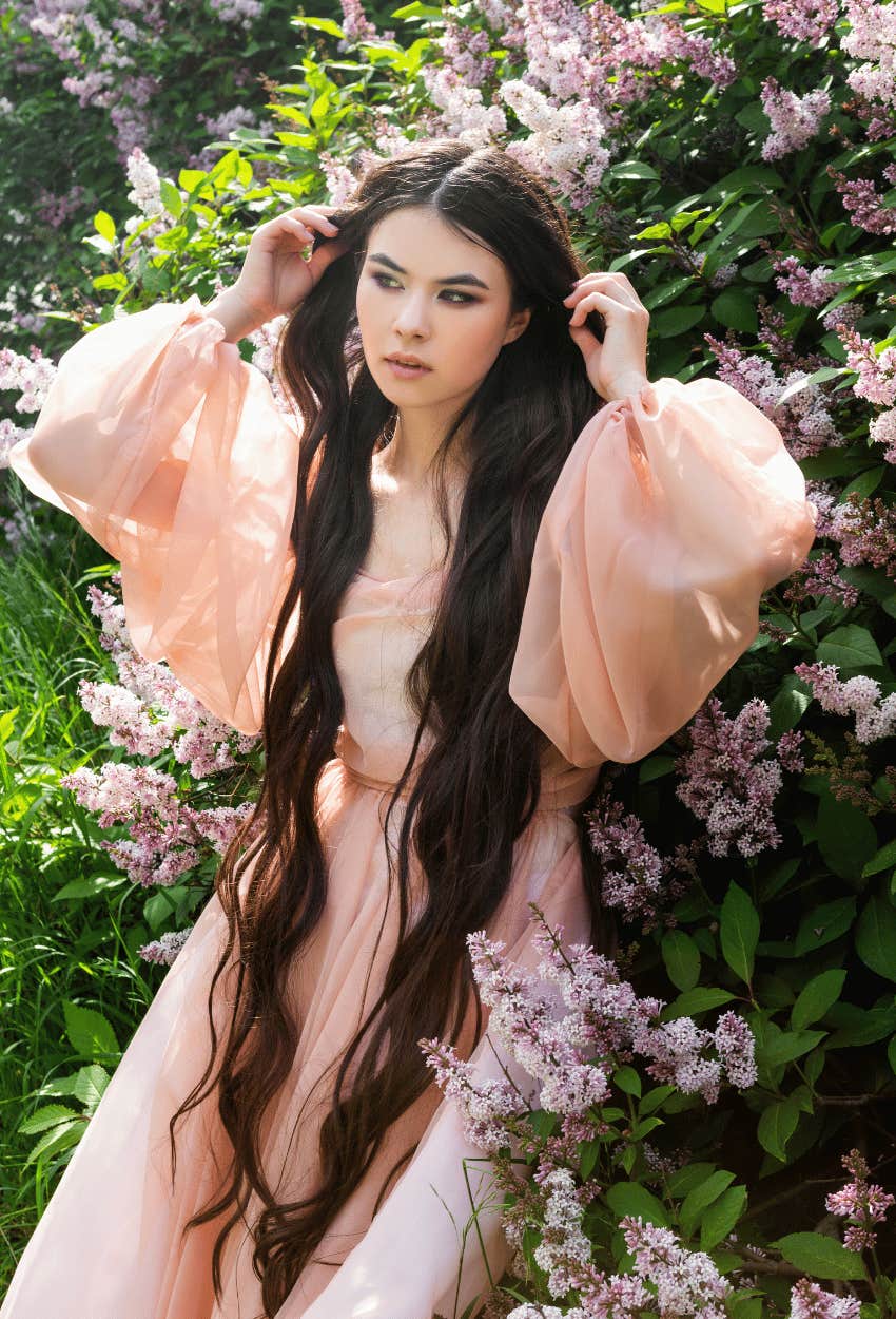Woman with naturally long hair who is connected to nature