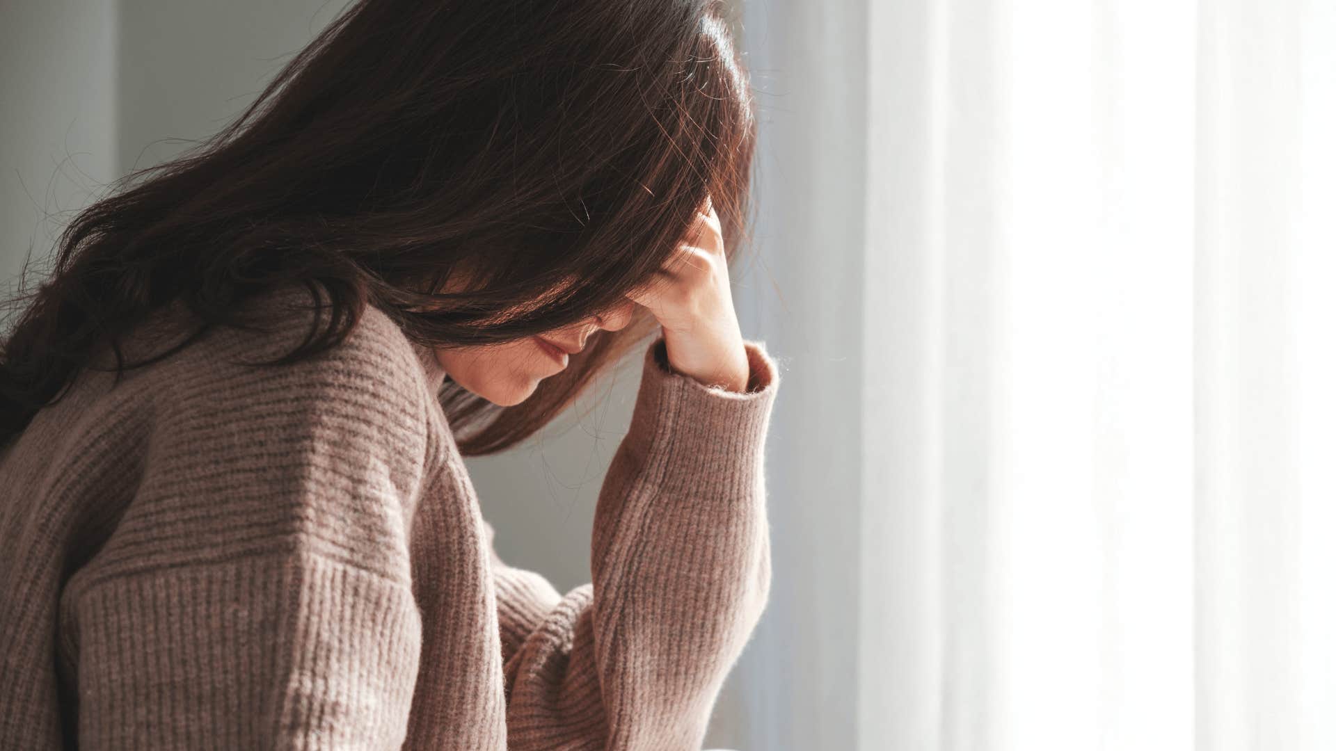 alone sad woman who's brain invents problems as a psychological truth