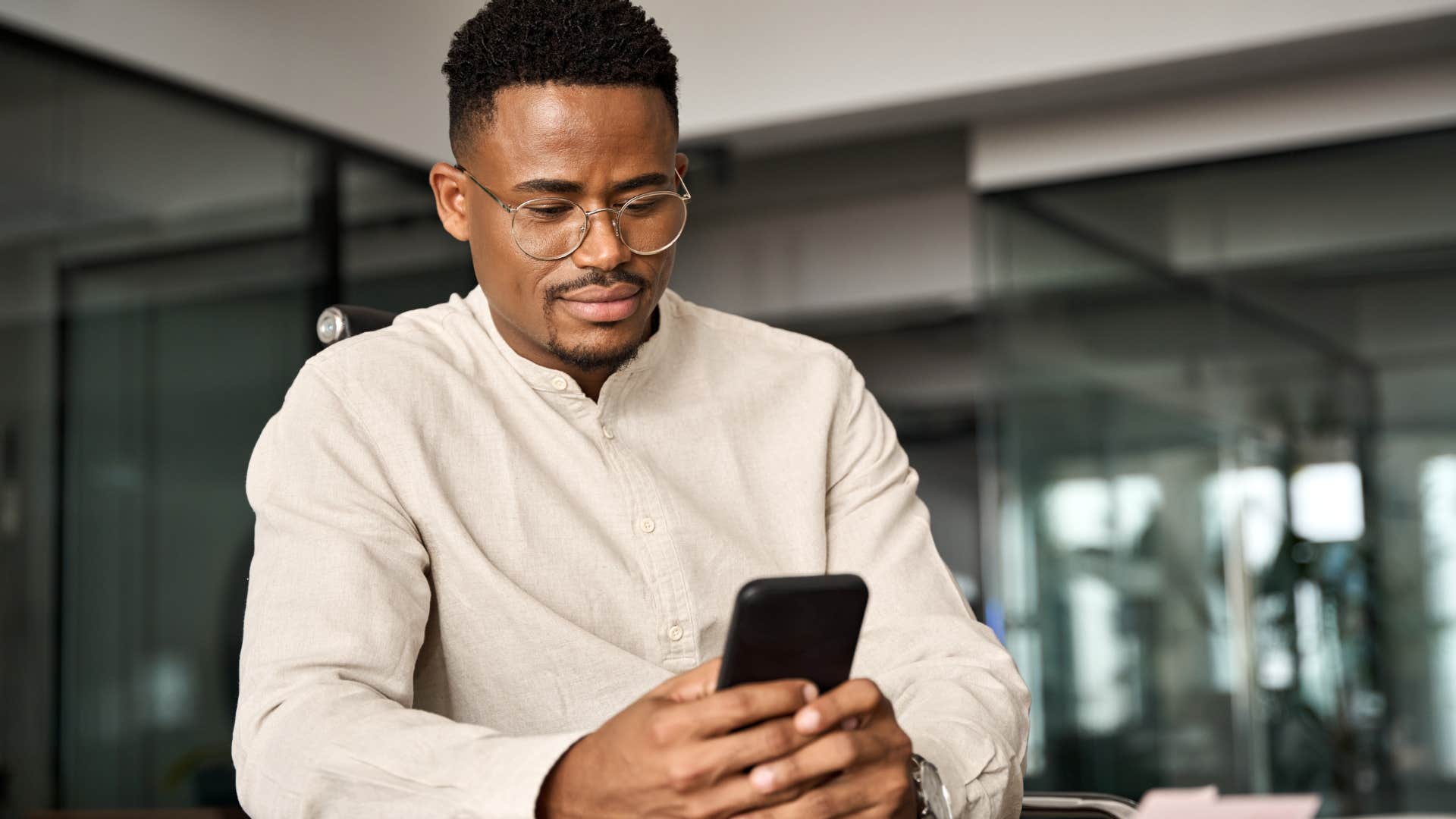 man blocking toxic friend's number on their phone