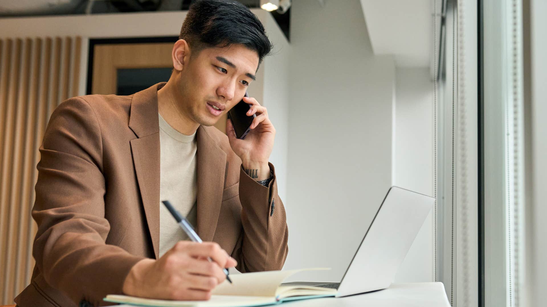 man turning discomfort into change working on his laptop
