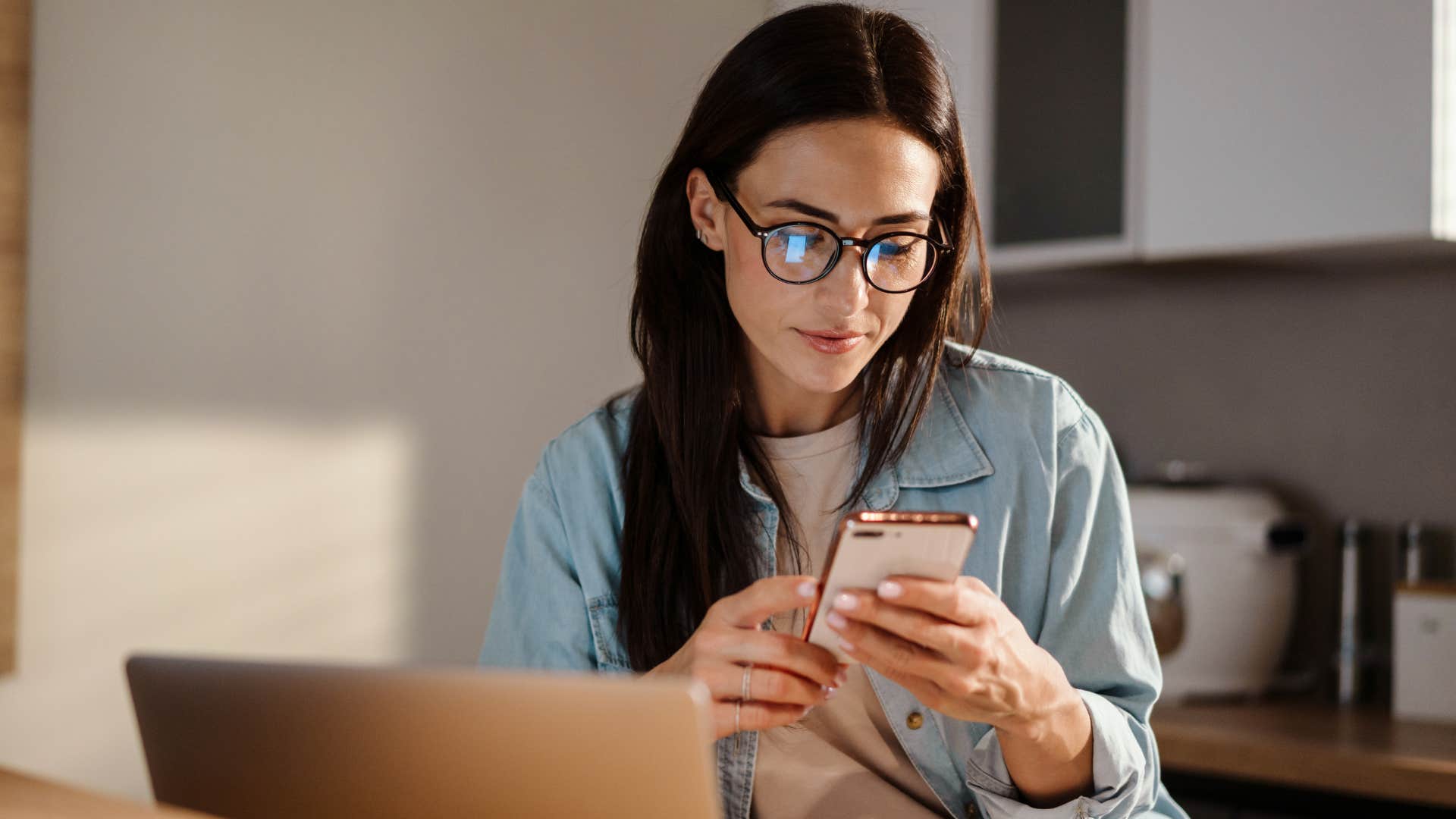 woman texting on her phone not reaching out to friend