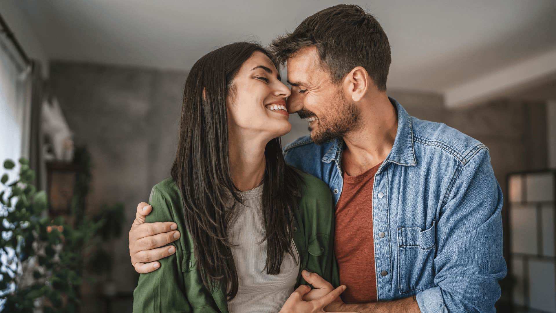 man hugging woman who he is truly falling for