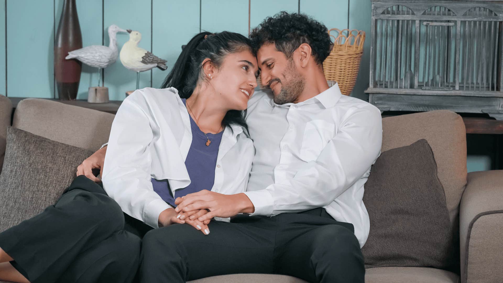 man who is falling for woman he is holding