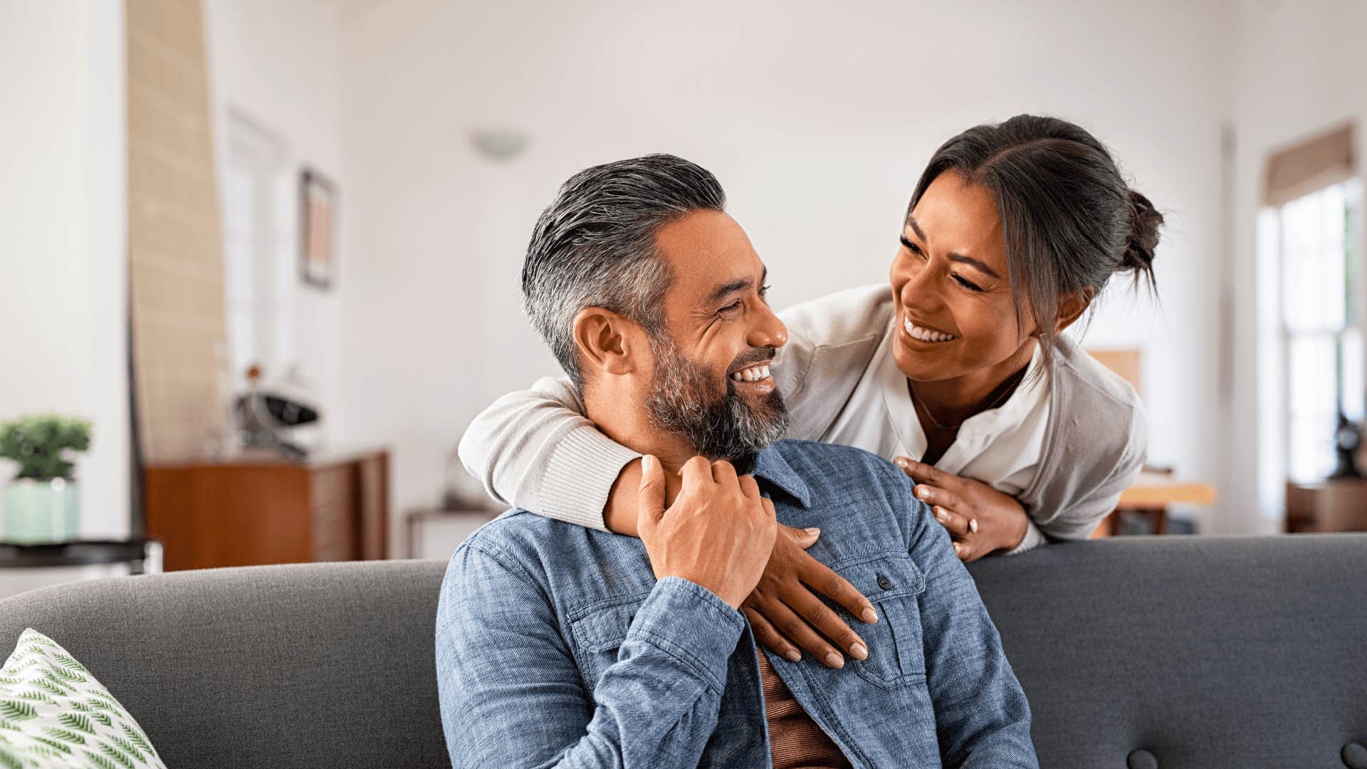 smiling memorable man looking at woman