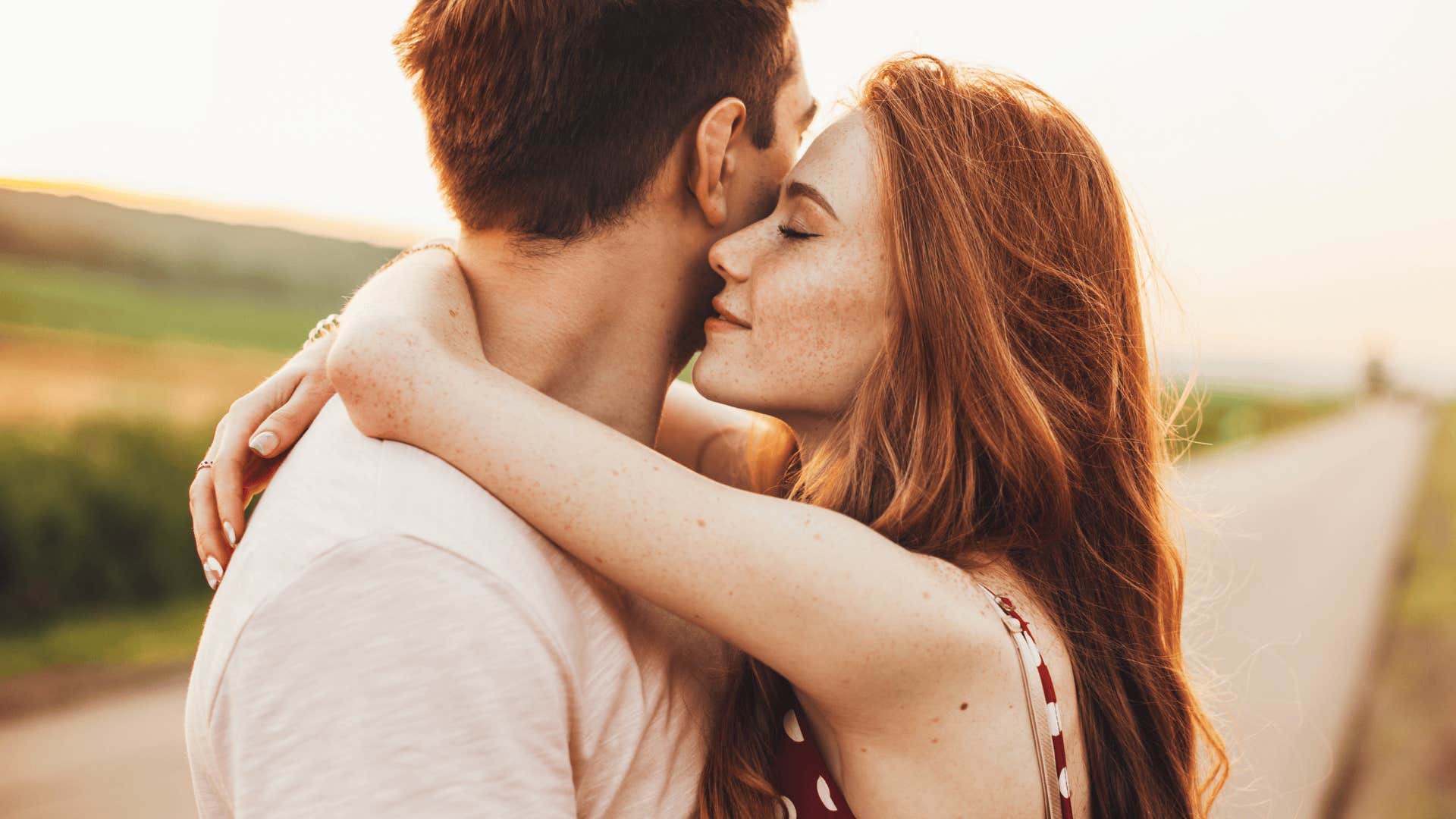 smiling unforgettable woman hugging man