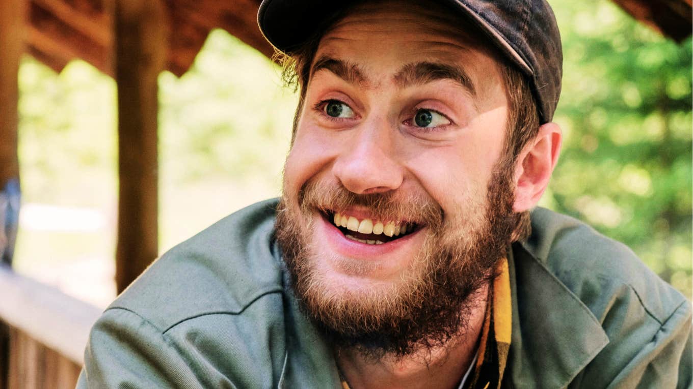 Rare Qualities That Make Someone Instantly More Likable When They Talk, According To Psychology Man who is instantly likable when he talks.