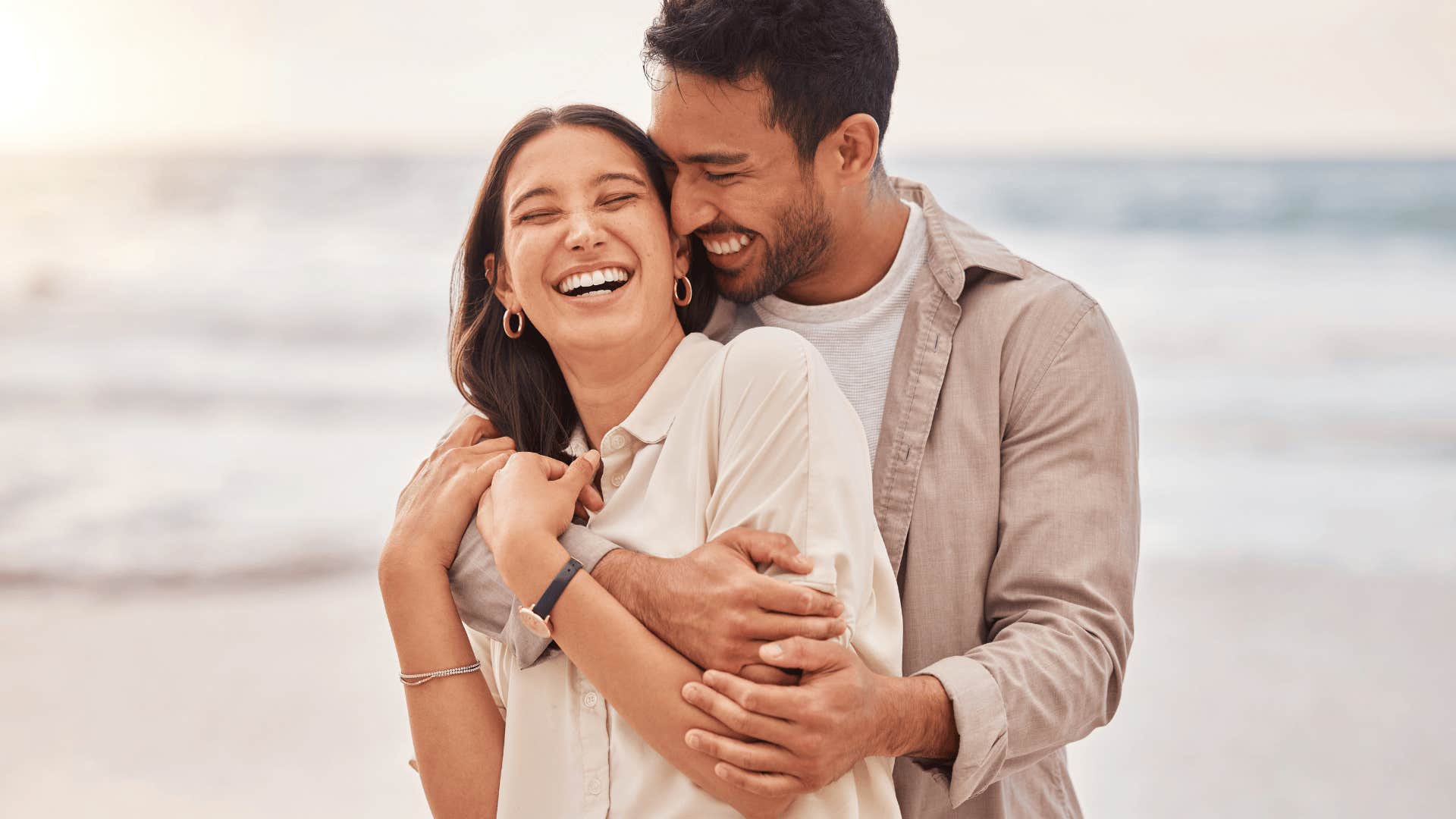 smiling woman being hugged by man she truly falls for