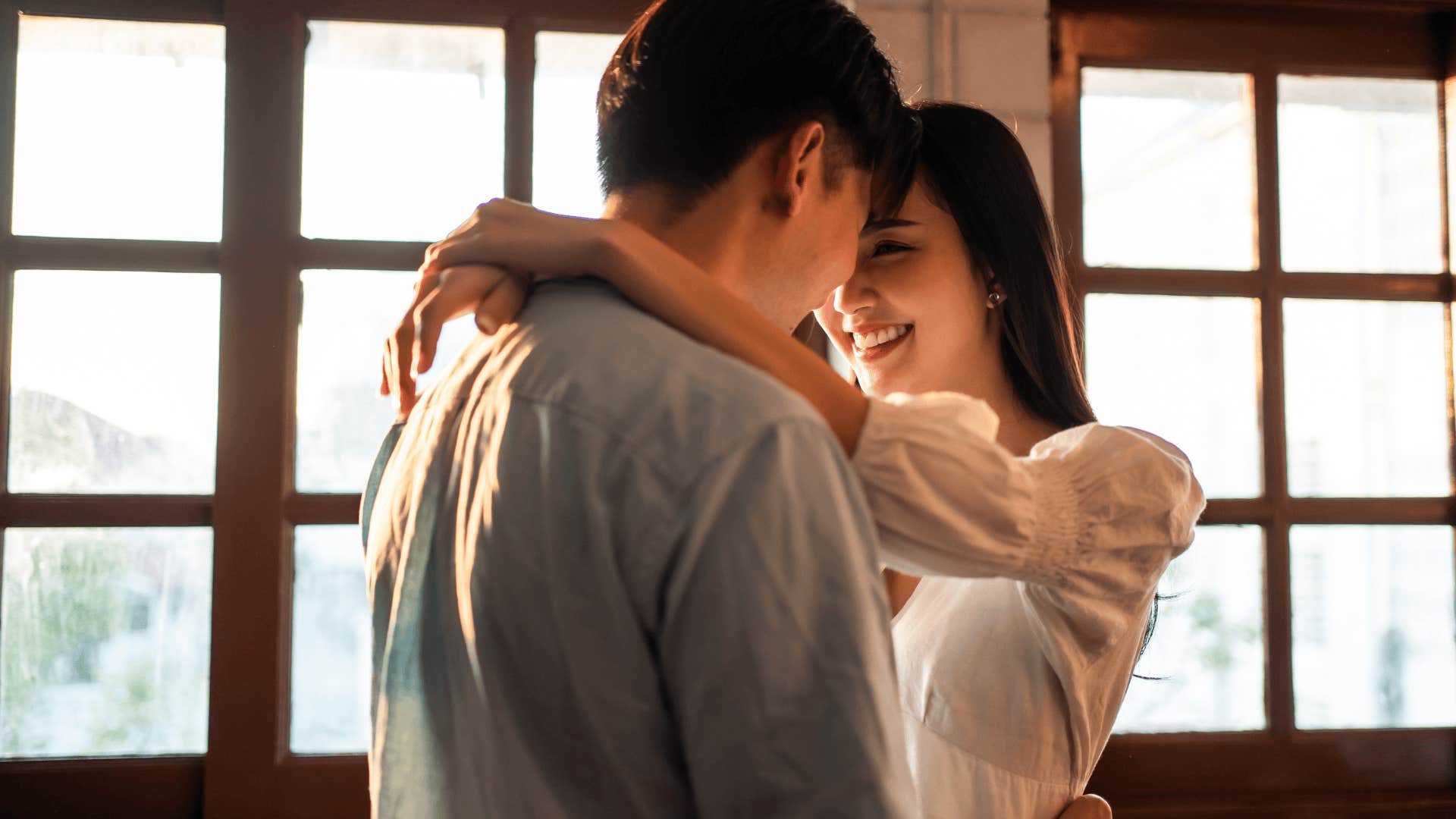 enviable couple hugging