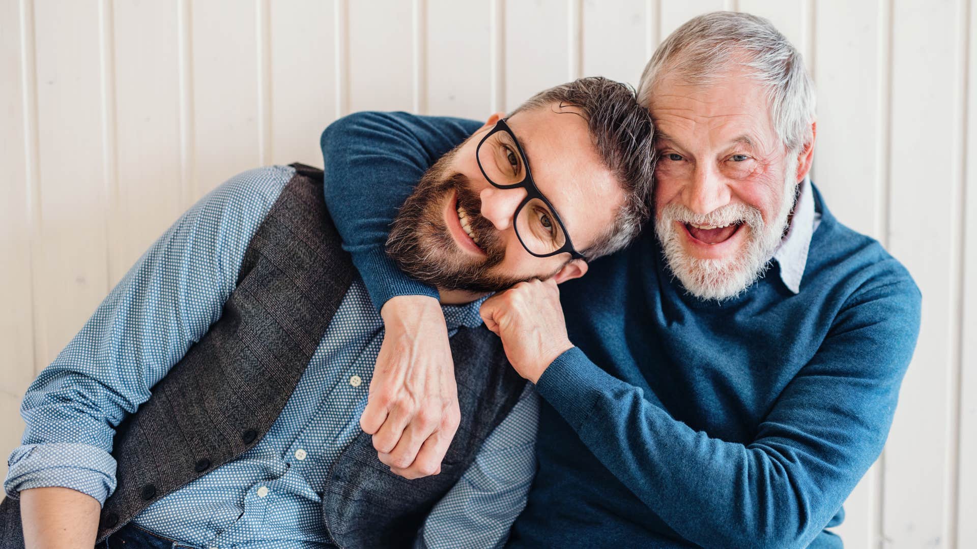man smiling hugging his dad