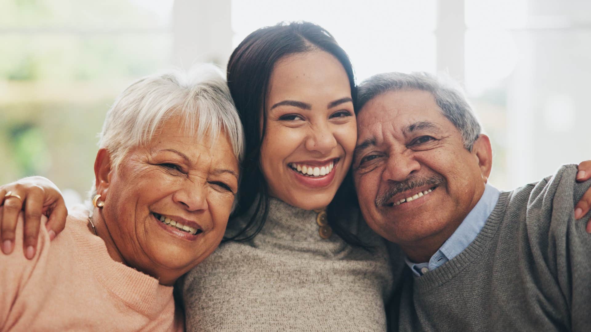 happy woman hugging parents for instilling good values