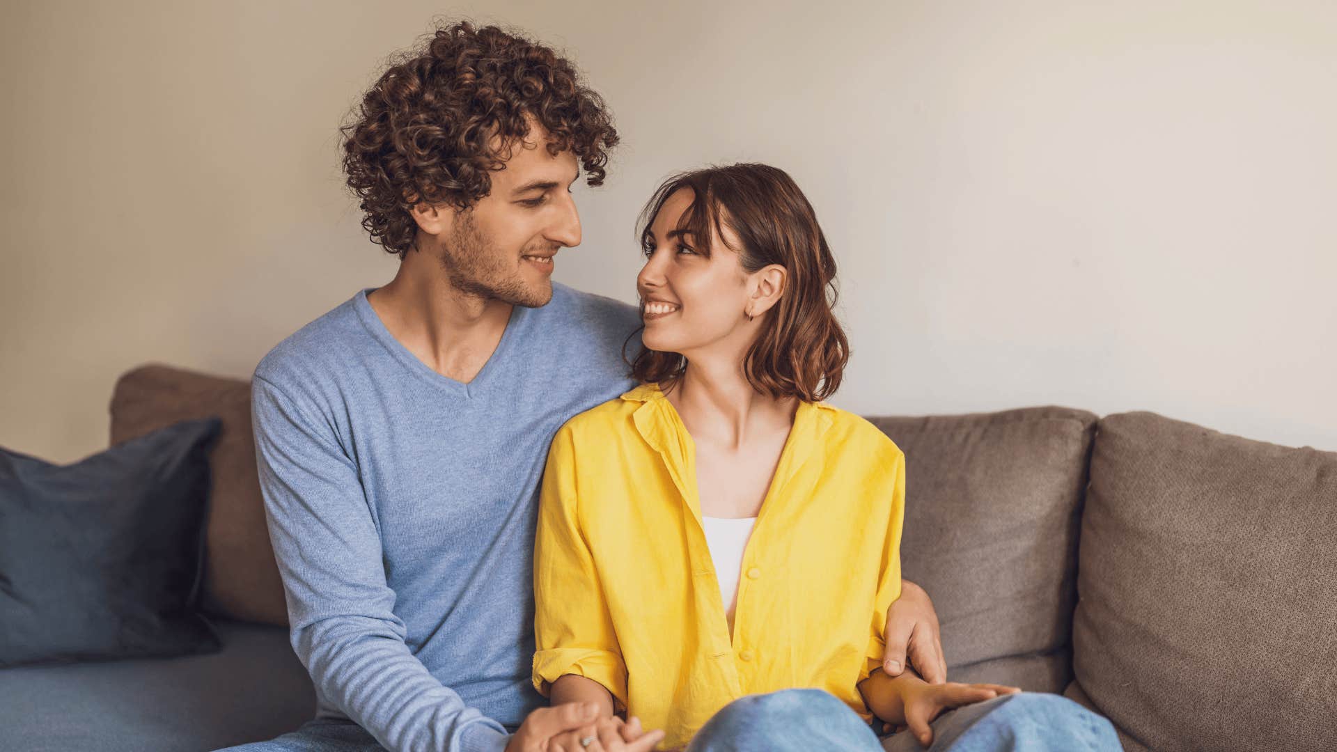 smiling woman sitting with man who would never cheat