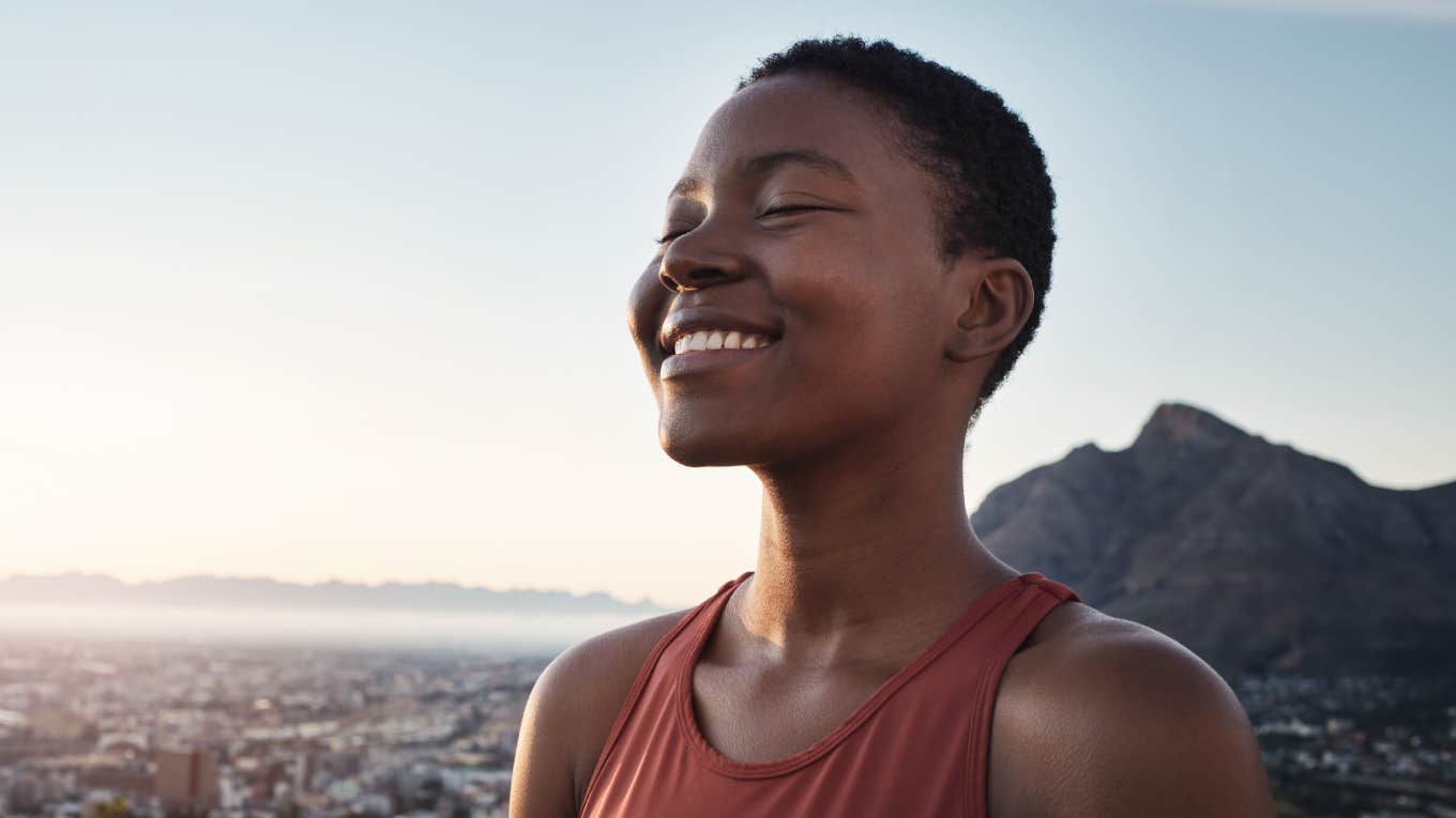 6 Rare Traits Of People With Strong Spiritual Energy That’s Hard To Ignore woman smiling while standing outdoors