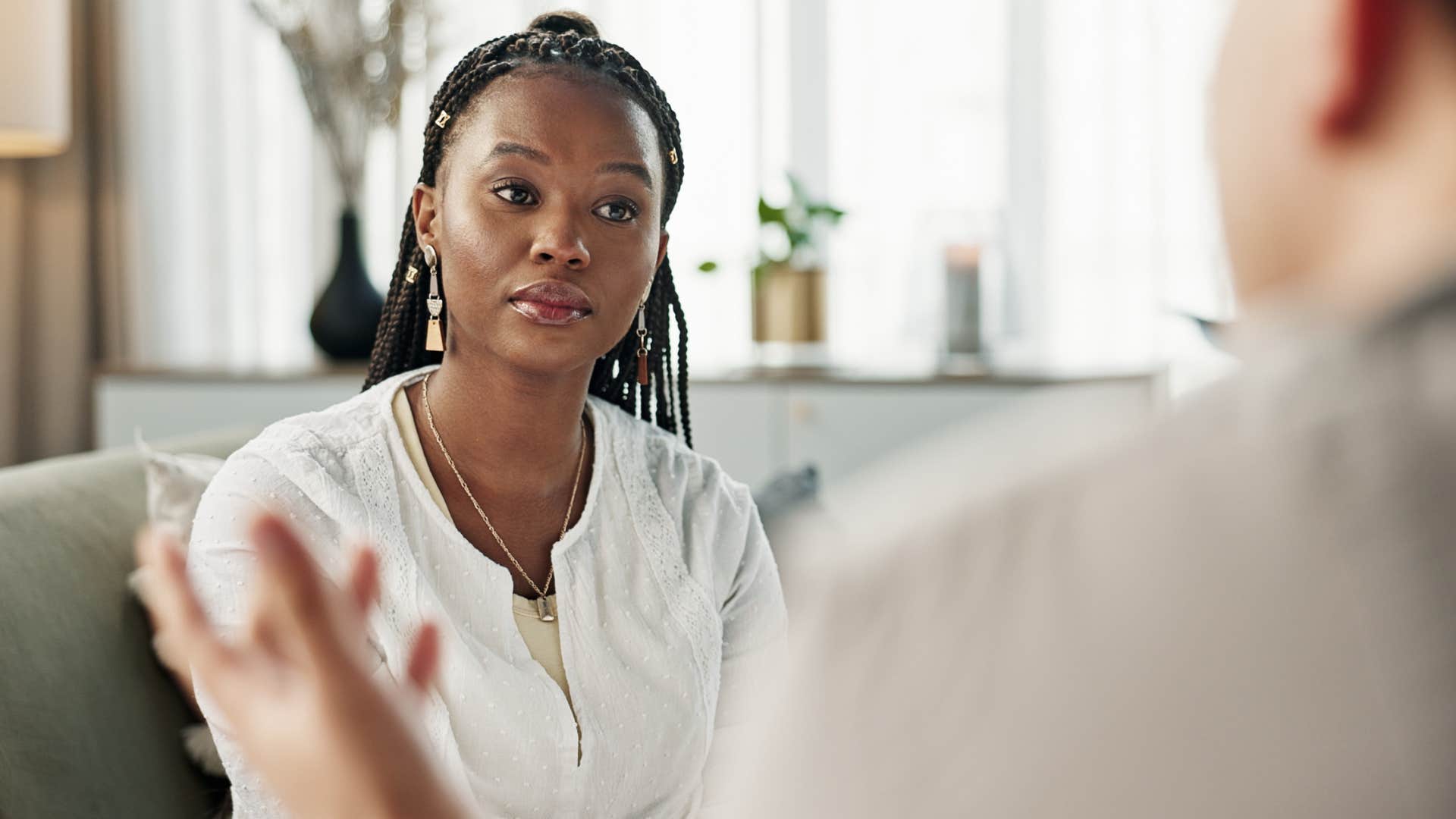 woman looking at a man who seeks praise from others