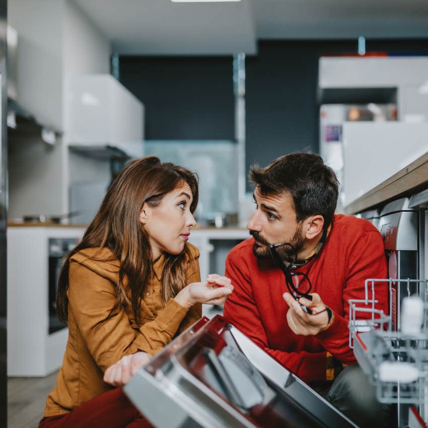 couple looking at dishwasher