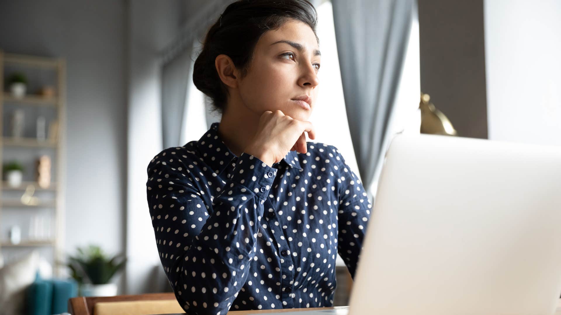 sad woman looking unfulfilled about success