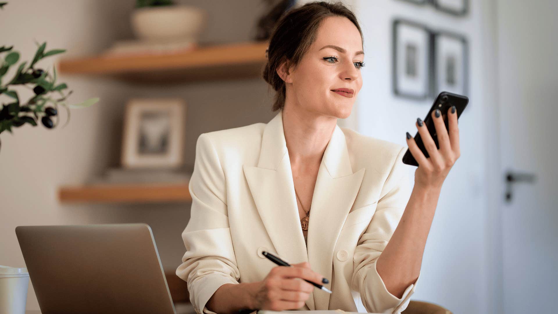 Professional woman is able to decode underlying subtext when reading a text on her phone