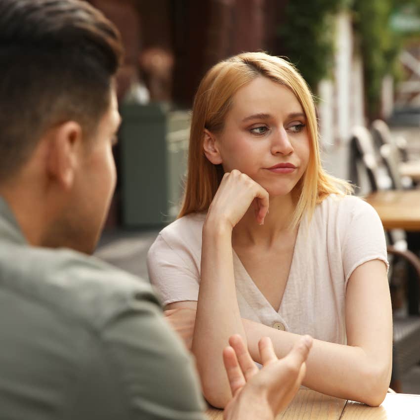 incompatible woman on a bad date with a man