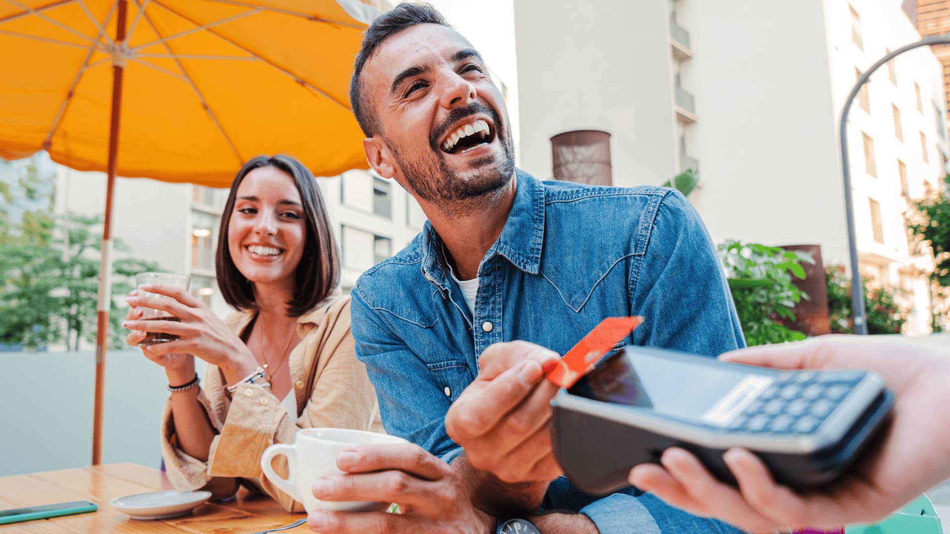 couple paying at restaurant with credit card
