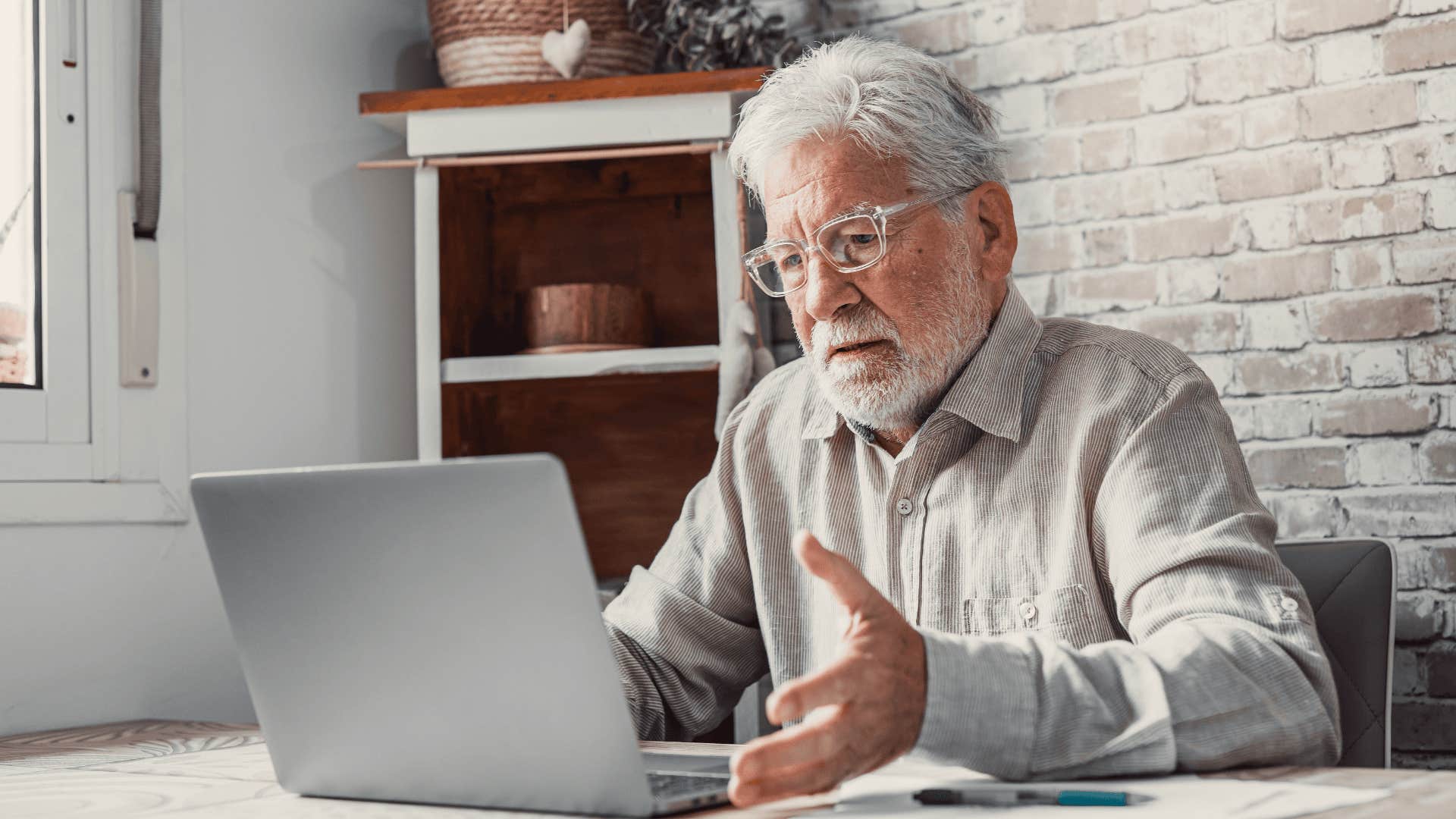 frustrated older man working on his computer
