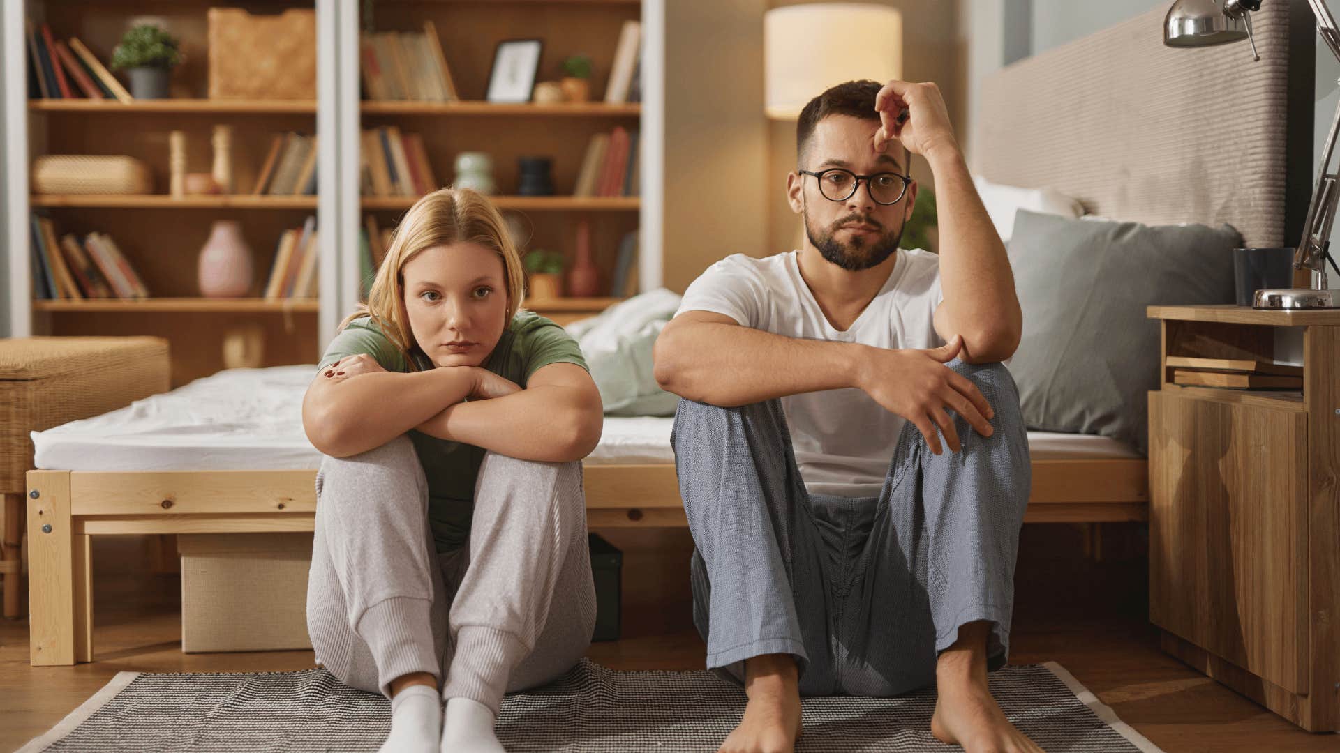 upset woman sitting next to man who is really hard to love