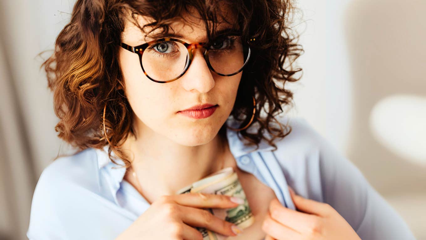 Are You A Saver, Spender, Or Avoider? Your Financial Type Reveals A Lot About Your Money Mindset Woman whose financial type is a saver.