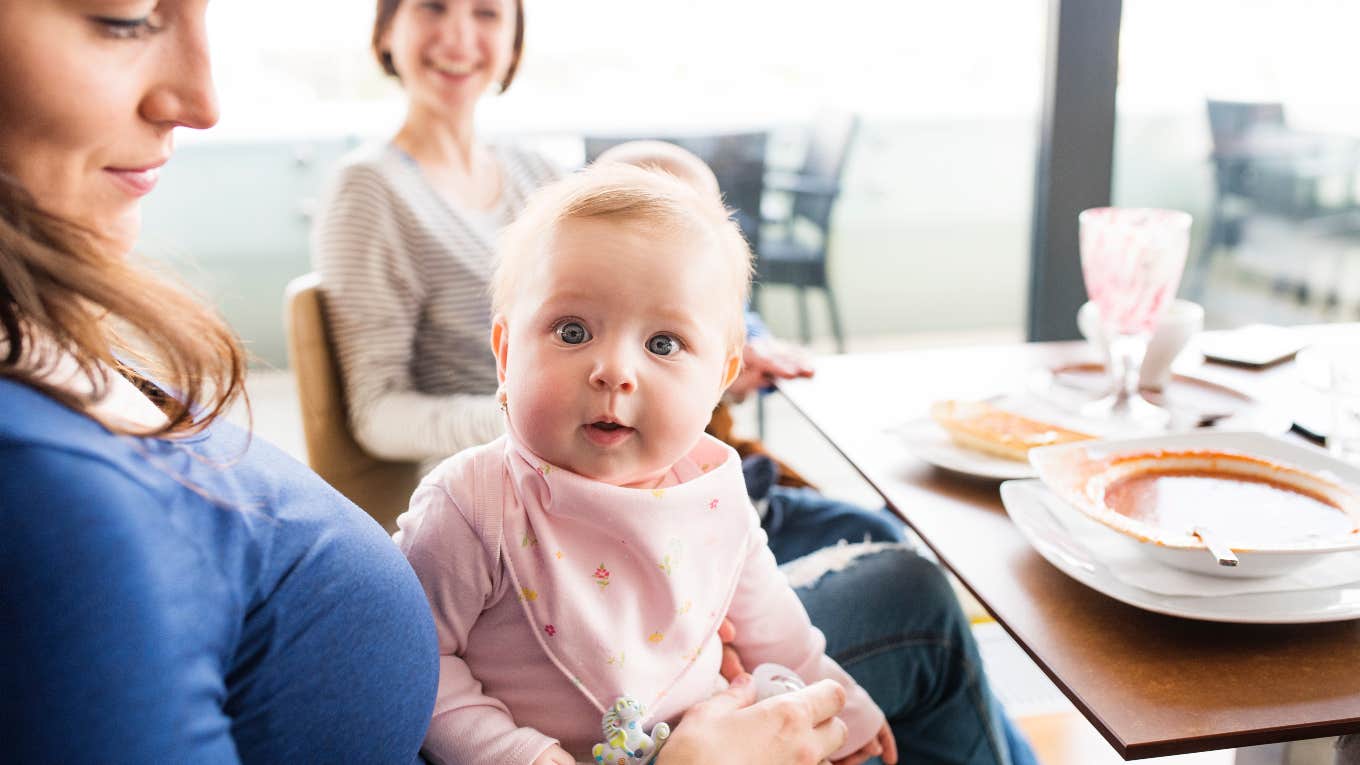 Server Holds Couple's Baby While They're Eating To Give Them A Break server holding couple's baby while they eat