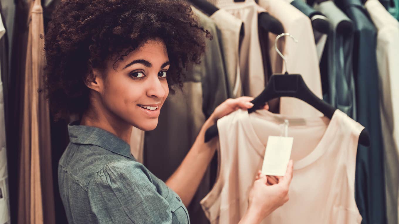 Shoppers Pick Out Recession Core Clothes That Suggest We’re Headed Into Hard Times Woman shopping for recession core clothes