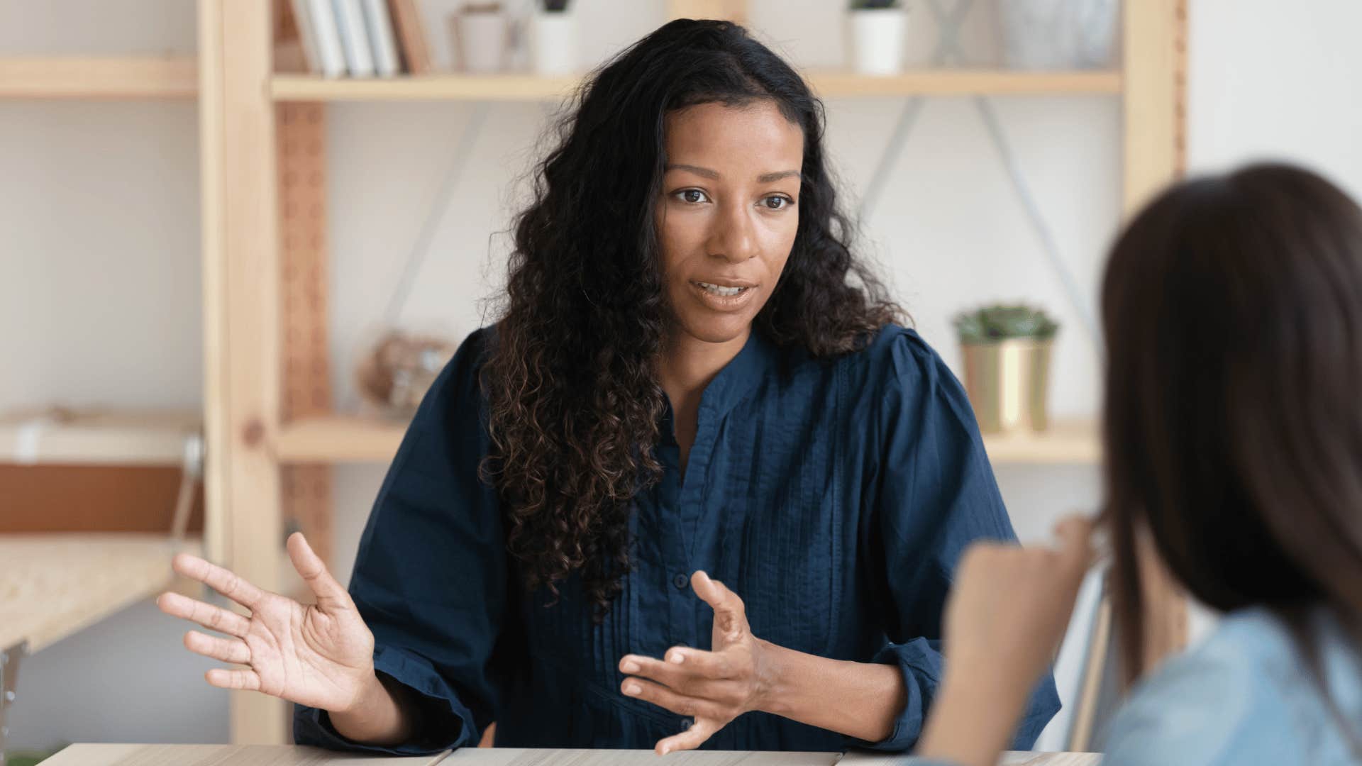 woman taking responsibility for her actions speaking to co-worker