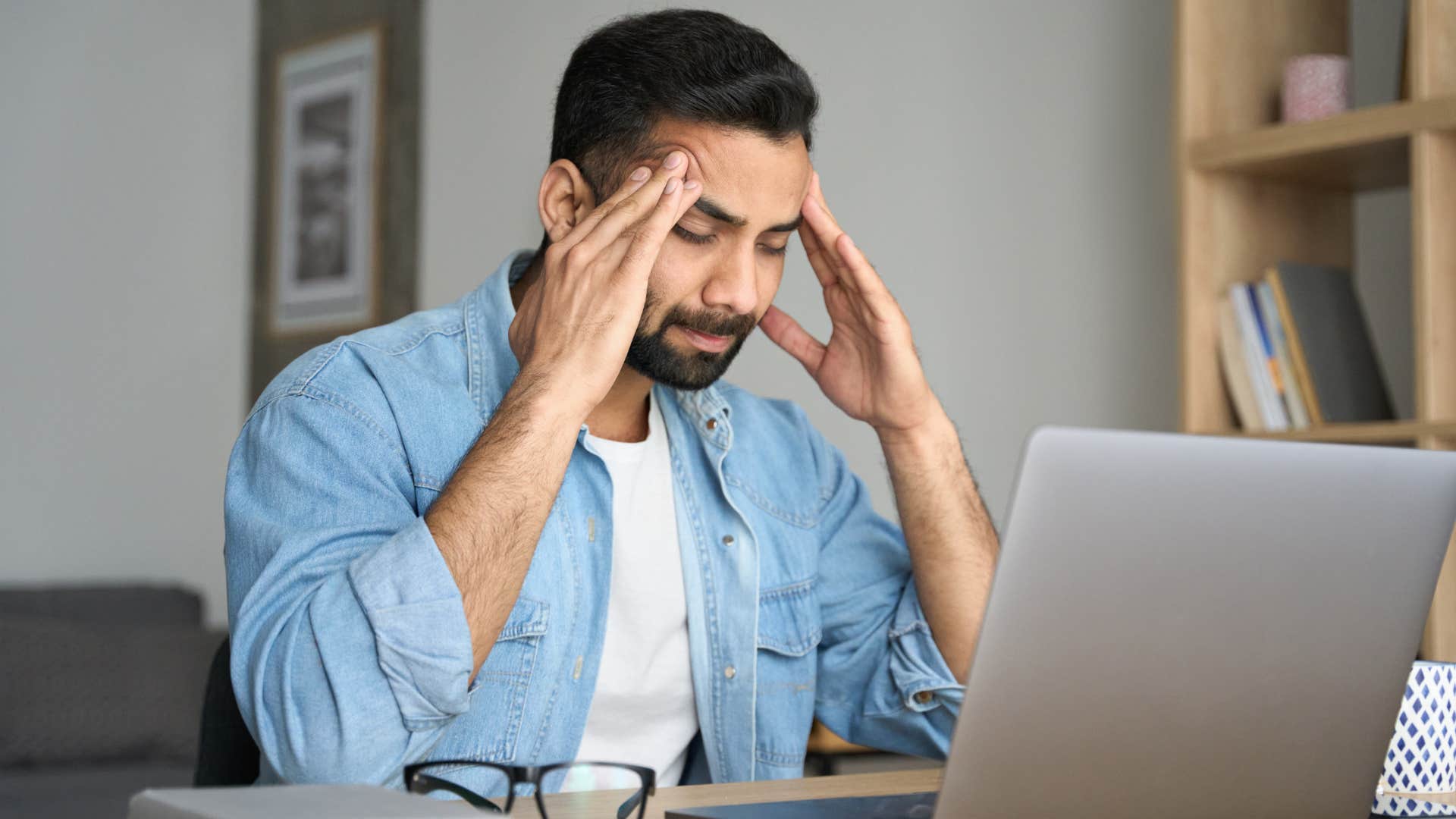 man blaming himself for financial struggles