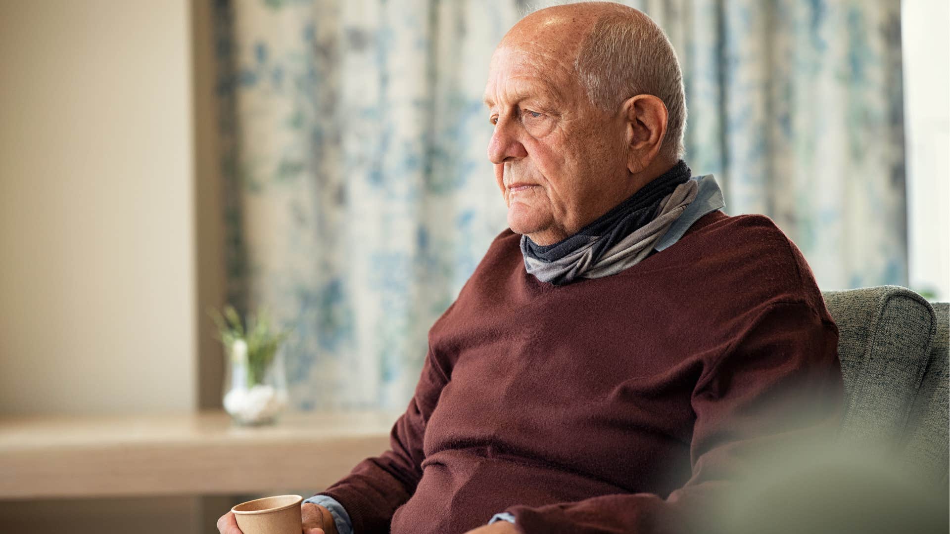 lonely man not dedicating time to his hobbies sitting alone and sad