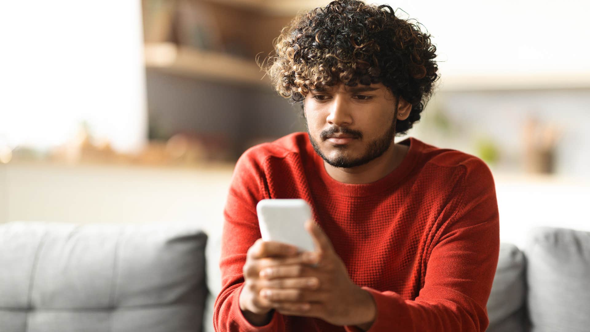 sad man using humor to cope with emotional struggles