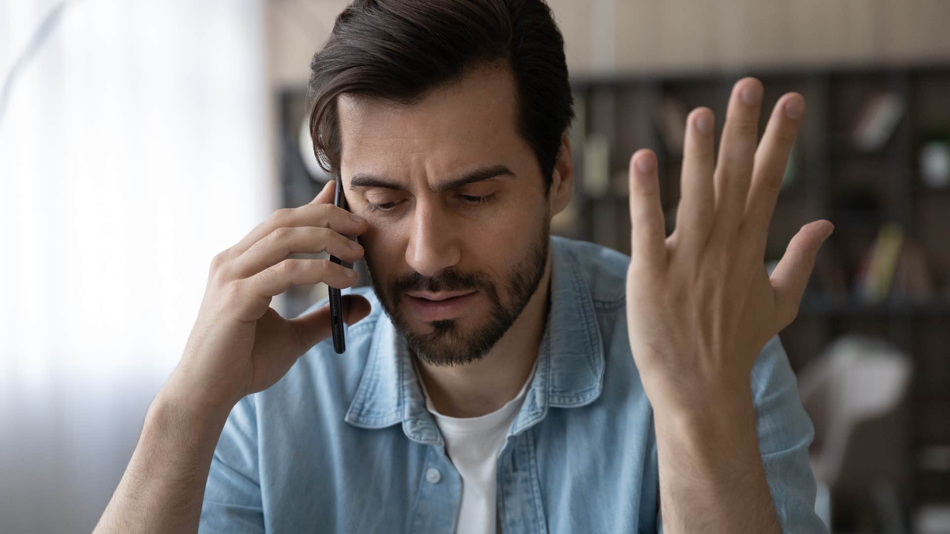 man over-explaining himself talking on the phone